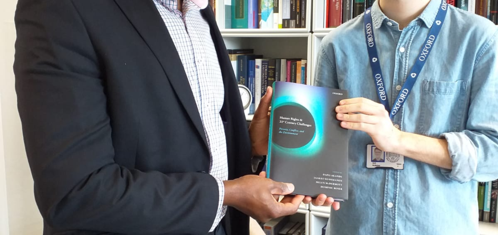 Dapo Akande and Jack McNichol (OUP) with the book 'Human Rights and 21st Century Challenges' 